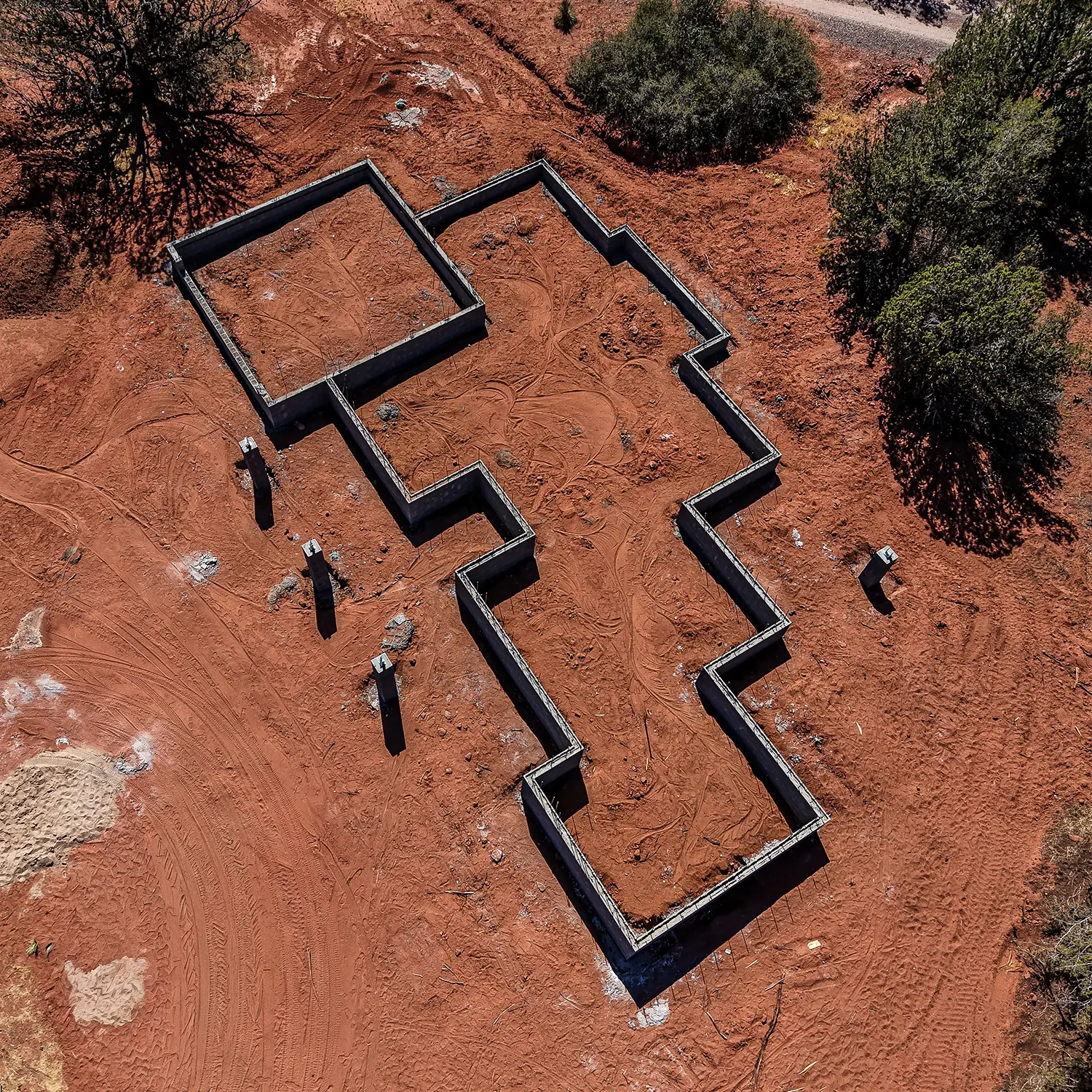 Festas-SwaleInProgress.hardscapeEmployeeworking2 Footings